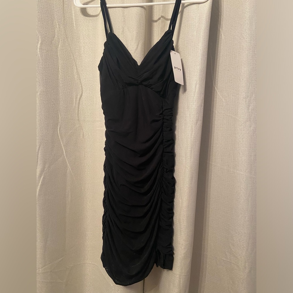 Shirred black mini dress. NWT